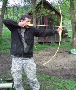 In Clay's backyard shooting the bow for the first time.